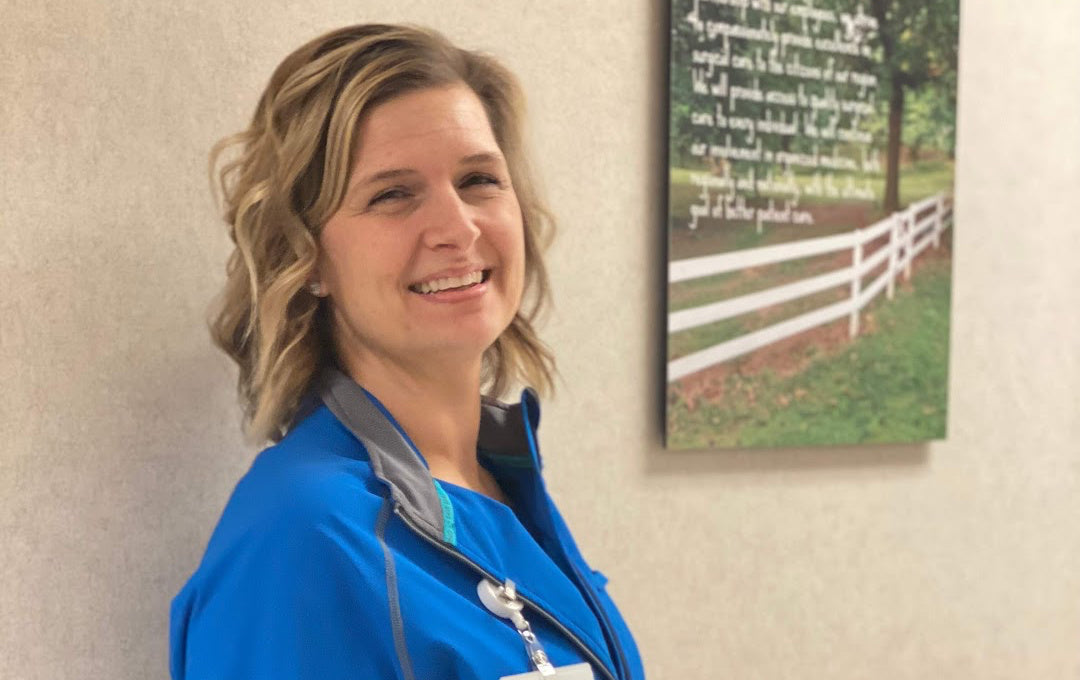 Pretty-nurse-doctors-office-royal-blue-scrubs