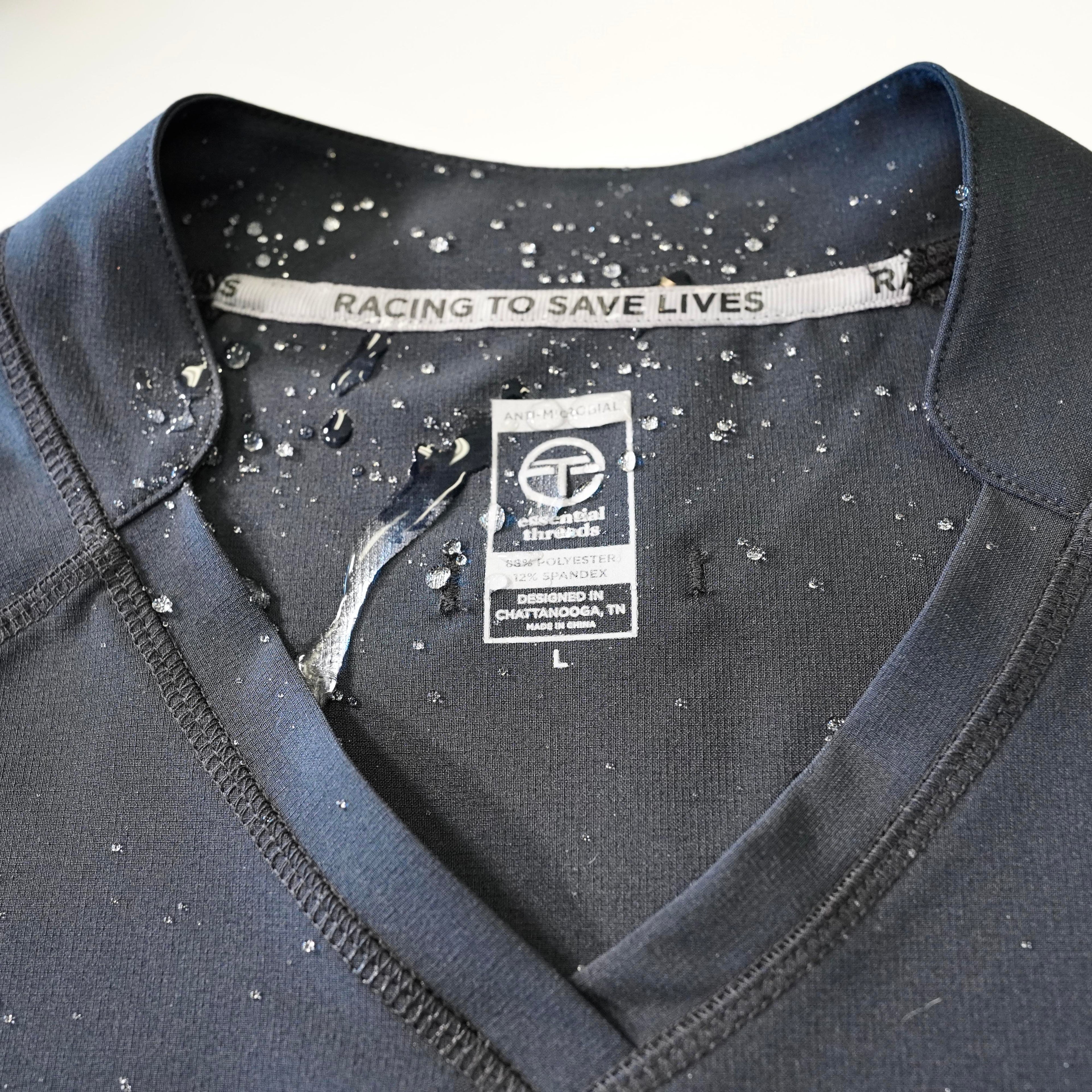 Black scrub top with water repellant properties